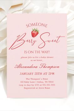 a baby shower is on the way for someone to have a strawberry in their hand