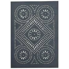 an intricately designed piece of art with white dots and circles on dark blue paper