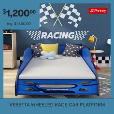 a blue bed with racing flags on the wall behind it is for $ 200 00