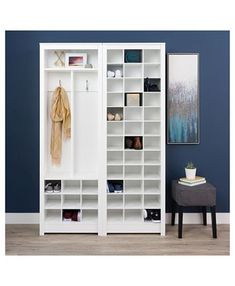 a large white bookcase with many shelves