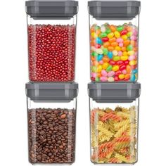 three containers filled with different types of candy