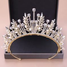 The Gold Rhinestone Pearl & Crystal Tree Tiara Is A Bridal Dream Come True. This Breathtaking Piece Comes With Stunning Rhinestone Details And Beautiful Tree Branches Made Of Crystals And Pearls. Tiara Height: 2.6” Inches Tiara Width: 14.75” Inches #Crystaltiara #Bridaltiara #Bridalaccessories #Hairaccessories #Weddingaccessories Veil Crystal, Pearl Veil, Leaf Crown, Wedding Hair Headband, Rhinestone Tiara, Princess Tiara, Headband Tiara, Crystal Tiaras, Wedding Headband