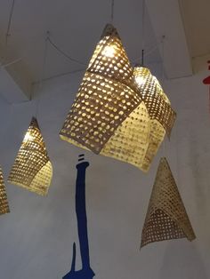 several lamps hanging from the ceiling in a room