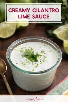 creamy cilantro lime sauce in a small glass jar with a spoon next to it