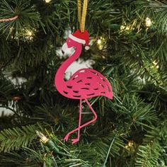 a pink flamingo ornament hanging from a christmas tree