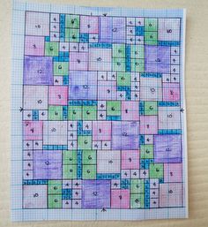 a piece of paper that has been drawn on top of it with numbers and squares