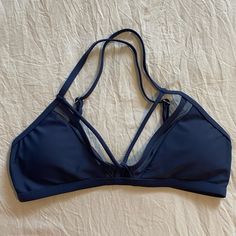 Nwot, Never Worn! Damsel Brand Bikini Top. Available From Tilly’s! Dark Blue With A Greyish Hue. Such A Pretty Color! Has Criss Cross Straps And A Fun Mesh Design In Front. Feel Free To Ask Questions Or Make An Offer! Matching Bottoms Are Available In A Separate Post, Size Medium. Navy Nylon Swimwear For Beach, Navy Nylon Swimwear For The Beach, Blue Sports Swimwear With Padded Cups, Blue Padded Sports Swimwear, Sports Swimwear With Padded Cups In Blue, Blue Strappy Sports Swimwear, Mesh Design, Pretty Colours, Cross Straps