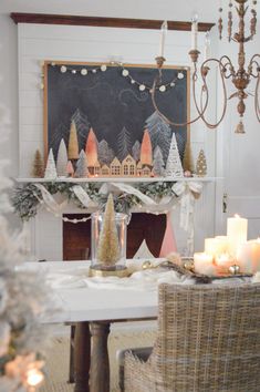 a dining room table with christmas decorations and candles