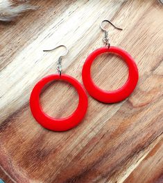 These fabulous drop hoop earrings are inspired by my love of all things mid-century and will be perfect for the upcoming holiday season. The circle hoops are made from a gorgeous bright red resin, and they are hung from delicate stainless steel ear wires. The hoops measure 38mm in diameter and the total earring drop is 60mm. You can find more of my 50s and 60s inspired drop hoops available here: www.etsy.com/uk/shop/RosieMays?section_id=25135598 Please get in touch if you'd like these in a diffe Drop Hoop Earrings, Red Circle, Earring Drop, Resin Earrings, Pin Up Style, Jewelry Earrings Hoops, Up Styles, Bright Red, Ear Wires