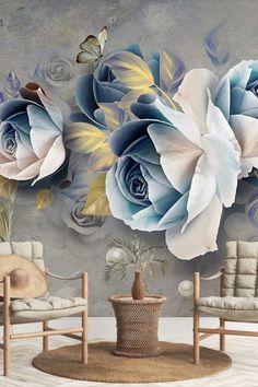 a living room with two chairs and a large flower mural on the wall