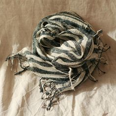 One-of-a-kind scarf made of handloomed raw cotton strand. Each cotton strands are spun manually by hand and harvested from local farms in Tuban region in Java island. If you love the feel of natural vegan fabric, you'll definitely won't take your hand off this scarf. Witness its beautiful stripes texture and gorgeous imperfections on each cotton looms. Cute fringe knots along the edges are also one of the adorable details not to be missed. • Dimension: 17 x 60 inches• Composition: Raw Cotton, Ha Bohemian Woven Cotton Scarves, Handwoven Cotton Bohemian Shawl, Bohemian Cotton Handloom Scarves, Traditional Cotton Scarf With Natural Dye, Traditional Cotton Scarves With Natural Dye, Coastal Living Magazine, Real Simple Magazine, Cute Fringe, Java Island