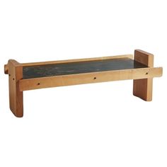 a wooden bench with a chalkboard underneath it