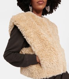 Feliz Faux Shearling Vest in Beige - Marant Etoile | Mytheresa Chic Sleeveless Outerwear With Faux Fur Trim, Chic Faux Fur Vest For Fall, Sleeveless Sheepskin Vest For Fall, Fall Sheepskin Sleeveless Vest, Faux Shearling Vest, Luxury Outerwear, Shearling Vest, Color Name, Color Names