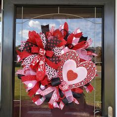 a valentine's day deco heart wreath on a front door