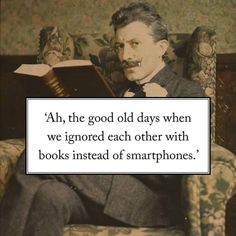 a man sitting in a chair reading a book with a quote about books instead of smartphones