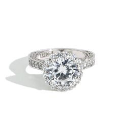 a diamond engagement ring with an halo setting on the shan shan shan shan shan shan shan shan