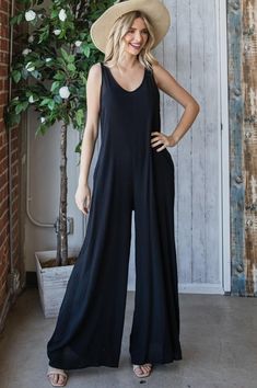 Black Light weight Jumpsuit with tie back detail in back and Pockets Relaxed Spring Jumpsuits And Rompers, Versatile Black Jumpsuits And Rompers For Summer, Black Versatile Jumpsuits And Rompers For Summer, Relaxed Summer Overalls And Rompers, Black Relaxed Fit Wide Leg Jumpsuits And Rompers, Versatile Summer Jumpsuits And Rompers For Loungewear, Black Relaxed Fit Jumpsuits And Rompers For Spring, Black Wide-leg Jumpsuits And Rompers For Summer, Black Wide Leg Jumpsuits And Rompers For Loungewear