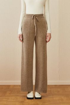 Cozy Elegance: Warm Wool Pants for Stylish Comfort Embrace the cooler seasons with these essential wool lounge pants, perfect for both office and leisure. Crafted for the fashion-conscious, they offer slight stretch for comfort and are ideal for the fluctuating temperatures of spring, fall, and winter. The quality wool fabric ensures warmth and a unique style. The solid color and simple design make them versatile for any top, from business casual to everyday wear. The delicate knitting adds soph Elegant And Simple Outfits, Fall Pants 2024, Warm Winter Pants, Knitted Pants Outfit, Fashion Rebranding, Wool Pants Outfit, Outfits With Ankle Boots, Lounge Wear Winter, Winter Pants Women