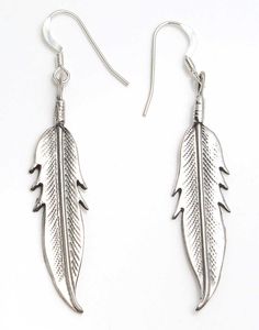 "Intricately detailed sterling silver feather earrings by Navajo artist Louise Joe. Earrings have a hanging length of 2"" while the feather itself is 1 1/2' x 3/8"" wide. Earrings weigh 4 grams +-." Adjustable Silver Feather Earrings, Silver Bohemian Feather Earrings, Adjustable Silver Earrings With Feathers, Bohemian Silver Feather Earrings, Feather Earrings Silver, Silver Feather, Feather Earrings, Sterling Silver, Silver