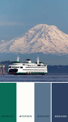 a large boat floating on top of a lake next to a snow covered mountain in the background