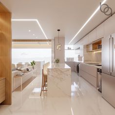 a modern kitchen with marble counter tops and stainless steel refrigerators, along with an island in the middle