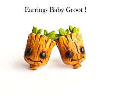 there are two baby groots that have leaves on their heads, and the words earrings baby groot