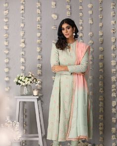 Description: Princess cut anarkali with anchor embroidered flowers all over. Accompanied by churidaar and ombre dupatta with lace all over borderColour Pista GreenFabric ChanderiCare Dry Clean onlyFit Tailored Anarkali Kurta In Pista Green With Dupatta, Anarkali Kurta With Dupatta In Pista Green, Pista Green Anarkali Kurta With Dupatta, Anarkali Set With Resham Embroidery In Mulmul, Mulmul Anarkali Set With Resham Embroidery, Resham Embroidered Mulmul Anarkali Set, Churidar With Sheer Dupatta In Traditional Drape, Churidar With Sheer Dupatta And Traditional Drape In Mulmul, Traditional Mulmul Churidar With Sheer Dupatta