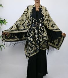 This gorgeous shawl is an easy throw and go addition. It’s tribal elements are woven into the garment. Great way to add a cozy, yet stylish finish to any outfit. Choose the black side or tan side…either way you are sure to look culturally chic. Belt not included. One Size Fits All Chic Belt, Black Side, One Size Fits All, The Black, To Look, Shawl, That Look, Black