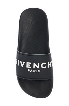 A dimensional Givenchy logo stands out on the wide strap of a laid-back slide sandal grounded with a star-studded sole. Synthetic upper, lining and sole Made in Italy Men's Designer Shoes Black Slides With Logo, Black Logo Slides, Luxury Slides With Cushioned Footbed, Black Logo Sandals For Summer, Black Slides With Logo For Summer, Black Logo Slides For Summer, Luxury Slides With Removable Insole, Summer Slip-on Slides With Embossed Logo, Designer Slides With Leather Sole