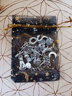 a small bag with some metal decorations on it