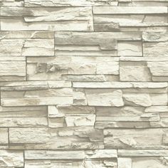 a stone wall that has been made from white bricks