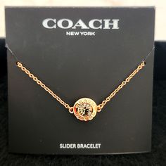 Coach Ny Slider Bracelet Goldtone Gold Logo On Center Circle With Crystal Elegant Rhodium Plated Adjustable Coach Bracelets For Parties, Coach Adjustable Jewelry For Party, Adjustable Coach Jewelry For Party, Coach Bracelet Jewelry Gift, Coach Bracelets As Gift, Coach Jewelry Bracelet Gift, Formal Adjustable Coach Bracelets, Coach Adjustable Bracelet As Gift, Adjustable Coach Bracelets As Gift