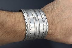 "I am offering vintage Turkmen traditional silver cuff Ersari Olomi tribe bracelet. Its 100% hand crafted workmanship with beautiful carved design. this bracelet made approximately 1940s. A row of 3 claws on each side are said to protect and invigorate the wearer, while shielding the delicate wrist area from injury. please do not hesitate to contact me if you have any questions or further information. Please visit my store for more beautiful items, Measures : Opening of the mouth : Inches 1.2\" Traditional Stamped Cuff Bangle, Bohemian Stamped Bracelets For Wedding, Bohemian Stamped Bracelet For Wedding, Traditional Silver Carved Cuff Bracelet, Traditional Engraved Cuff Bracelet, Traditional Stamped Bangle For Wedding, Traditional Etched Cuff Bangle, Traditional Etched Cuff Bracelet, Traditional Ceremonial Stamped Bangle