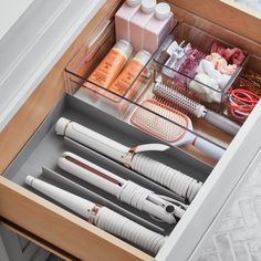 an open drawer with various items in it