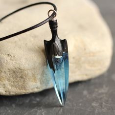 Beautiful necklace in the form of a crystal arrowhead. This is the perfect gift for yourself and loved ones! Materials: Bog Oak wood and resin, black cord, silver clasp. ► Your order will be packaged in a beautiful box, ideal for gifts, which is carefully packed in extra boxes for delivery. The pendant is made of wood with a jeweler resin and covered special natural oils in order to preserve the wood against external influences. The wood has a lovely gloss finish. ► Also look at all our wood res Spiritual Arrowhead Necklace Gift, Adjustable Arrow Jewelry As Gift, Handmade Arrowhead Jewelry Gift, Adjustable Arrowhead Necklace Gift, Wood Resin Necklace, Wood Resin Jewelry, Elven Jewelry, Wood And Resin, Pendant For Women