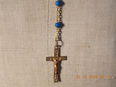 Vintage French  Rosary Beads Necklace in Blue crucifix Cross religious chain Jesus cross jewellery Vintage French Vintage French Rosary Beads Necklace crucifix Cross religious chain Jesus cross.Nice necklace Gold in colour with Blue beads, length of chain that goes around your neck is 21" (53cm) but does have an extra drop of 5" (13cm) where the cross hangs down. Nice piece of religious jewellery. Christian cross. Please have a look at my other Rosary bead chains for sale. Vintage Cross Jewelry With 8mm Beads, Vintage Cross Necklace With 8mm Beads, Vintage Cross Necklaces With 8mm Beads, Spiritual Crucifix Cross Necklace For Jewelry Making, Blue Cross Spiritual Jewelry, Blue Spiritual Cross Jewelry, Blue Crucifix Cross Necklace For A Gift, Blue Crucifix Necklace For Spiritual Wear, Blue Crucifix Necklace For Spiritual Purposes