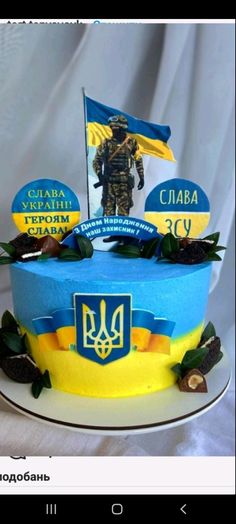 a cake decorated with flags and decorations for the day of remembrance to soldiers in ukraine