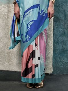 Step into a world of vibrant elegance with our multi-color crepe saree, adorned with exquisite digital print work. This stunning saree, measuring 5.50 meters, is paired with an unstitched sky-blue crepe blouse material, featuring complementary printed work. Perfect for any celebration, be it a festive party, a family gathering, or a formal occasion, this saree ensures you make a striking statement with its dynamic and sophisticated design.
The multi-color crepe fabric of the saree showcases a ha Summer Digital Print Saree, Traditional Summer Saree With Digital Print, Bollywood Style Blue Dupatta With Digital Print, Bollywood Style Blue Digital Print Dupatta, Traditional Summer Digital Print Saree, Blue Digital Print Dupatta For Festivals, Unstitched Blue Saree With Printed Motifs, Blue Semi-stitched Pre-draped Saree With Printed Border, Blue Floral Print Saree With Traditional Drape