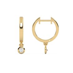 This yellow gold Small gold hoop earrings featuring a dangling 0.11 CT diamond on each hoop 14k Gold Huggie Earrings With Bezel Setting, Yellow Gold Bezel Setting Huggie Earrings Fine Jewelry, Yellow Gold Bezel Setting Huggie Earrings, Fine Jewelry Yellow Gold Huggie Earrings With Bezel Setting, Yellow Gold Huggie Earrings With Bezel Setting As Gift, Yellow Gold Huggie Earrings Gift, Yellow Gold Bezel-set Dangle Diamond Earrings, Yellow Gold 14k Huggie Earrings With Bezel Setting, Gold Dangle Diamond Earrings With Bezel Setting