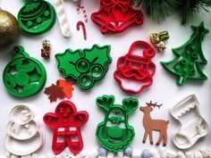 christmas cookie cutters and decorations on a table