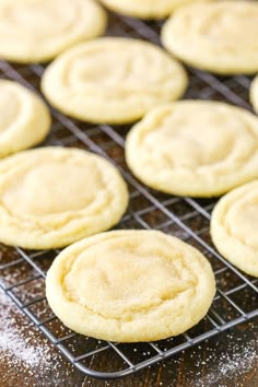 cookies cooling on a rack with powdered sugar