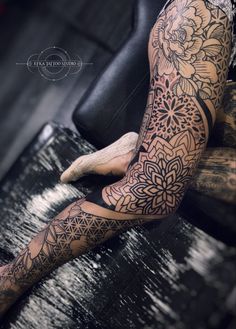 a person with tattoos on their arms and legs