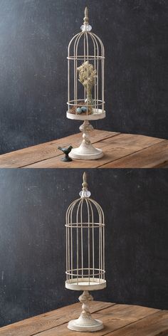 three white birdcages with flowers in them