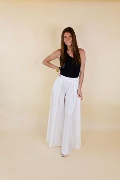 These adorable new pants are perfect for all occasions! Their super wide leg is flowy and ensures a flattering fit on all shapes and sizes! These pants include a zip up side, pleated detail on the front, a wide leg that measures 30 inches in diameter, and an inseam that measures 35 inches. Pair these with booties and a blazer for a fun look! Arté is wearing a size small. Size Suggestions: Small: 2-4 | Waist: 30 inches Medium: 6-8 | Waist: 32 inches Large: 10-12 | Waist: 34 inches Plus One Size: Chic Pleated Summer Pants, Trendy Pleated Wide Leg Pants For Summer, Chic Wide-leg Culottes For Summer, Chic Wide Leg Culottes For Summer, Chic Wide Leg Summer Culottes, Elegant Flowy Bottoms For Day Out, Pleated Solid Wide Leg Pants For Summer, Solid Pleated Wide Leg Pants For Summer, Summer Solid Pleated Wide Leg Pants