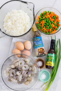 the ingredients to make this dish include rice, peas, carrots and eggs