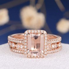 an engagement ring set with a pink morganite surrounded by diamonds