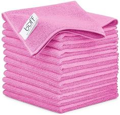 pink towels stacked on top of each other with a tag that says dolft