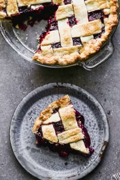 two pies on plates with one slice missing