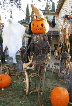 a yard with pumpkins and other halloween decorations