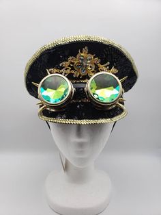 Black sequin police-style hat with gold trim and gold spiked goggles. Elastic strap fits snugly under the chin. One size. SHOP POLICIES: Orders placed Monday-Friday generally ship next day. Orders placed Saturday/Sunday ship the following Tuesday. Cancellations are permitted before an item ships. Please note that we do not accept returns. Vintage Adjustable Costume Accessories For Festivals, Gold Adjustable Costume Accessories For Costume Party, Gold Adjustable Costume Accessories For Party, Gold Steampunk Costume Accessories For Parties, Punk Style Adjustable Costume Accessories For Festival, Vintage Adjustable Costume Accessories For Carnival, Gold Steampunk Costume Accessories For Costume Party, Adjustable Gold Costume Hat For Costume Party, Gold Adjustable Costume Hats And Headpieces